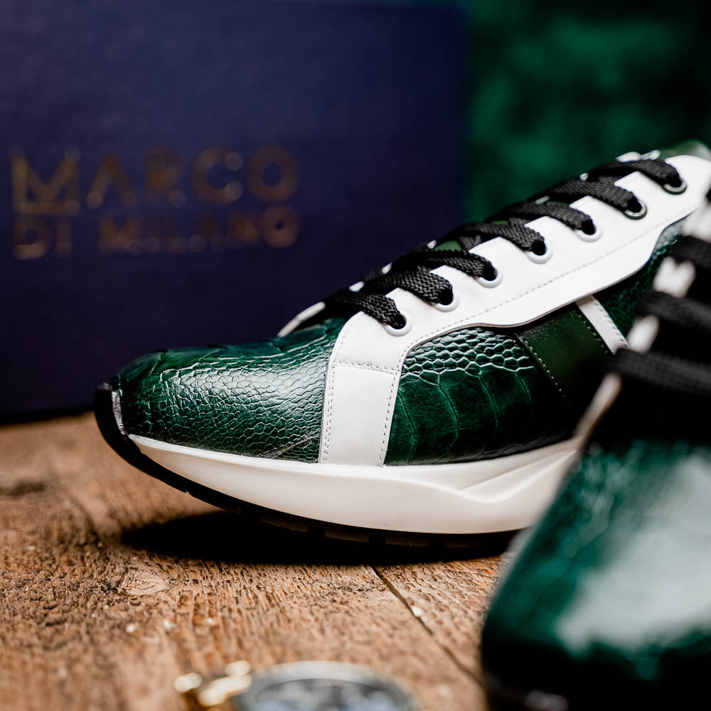The Marco Di Milano Lyon Green / White sneakers feature green and white genuine ostrich leather with texture, black laces, and white rubber soles—one shoe stands upright while the other leans against it.