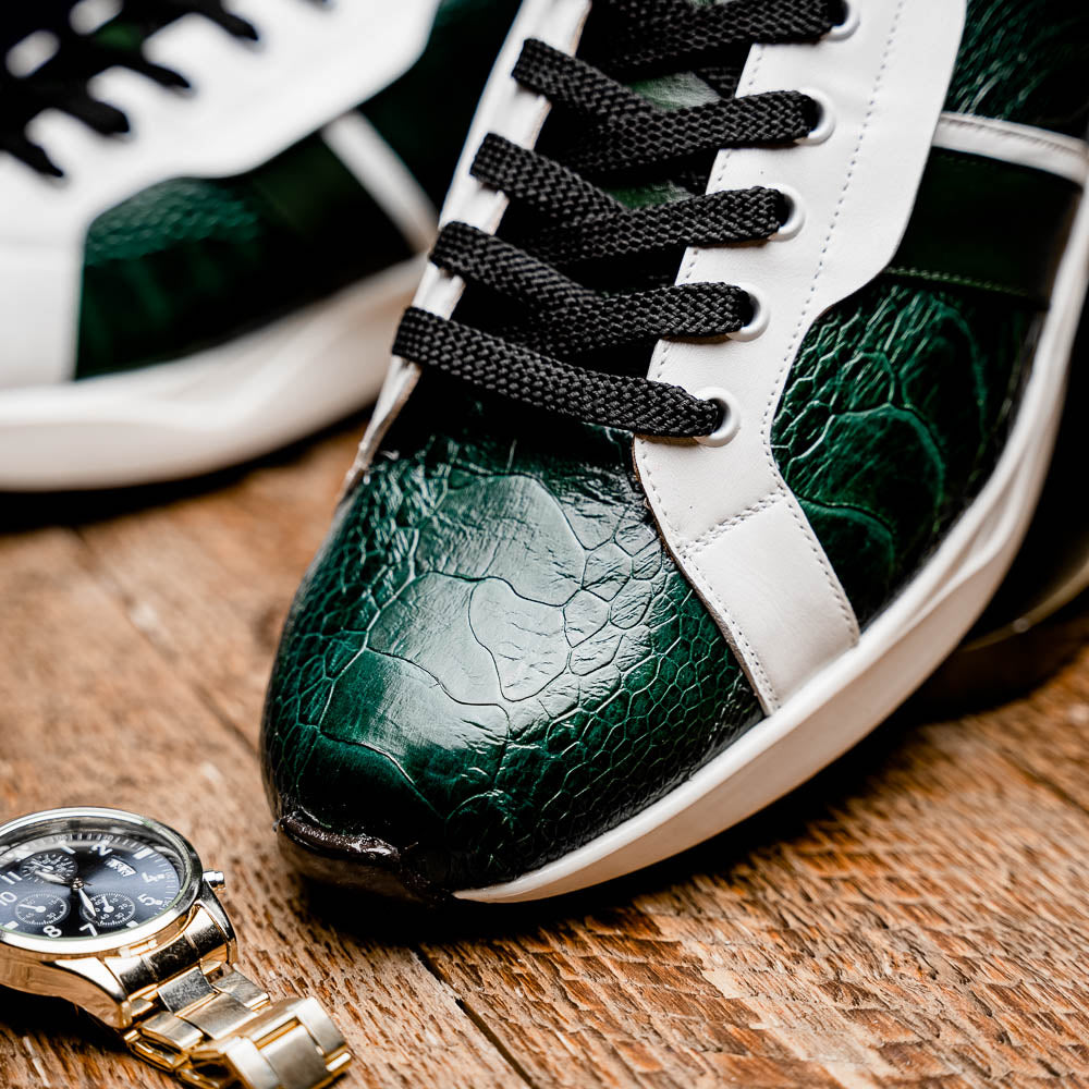 The Marco Di Milano Lyon Green / White sneakers feature green and white genuine ostrich leather with texture, black laces, and white rubber soles—one shoe stands upright while the other leans against it.