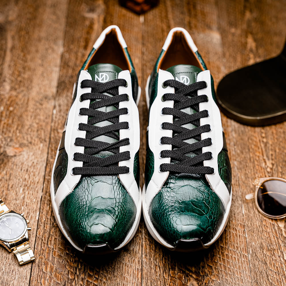 The Marco Di Milano Lyon Green / White sneakers feature green and white genuine ostrich leather with texture, black laces, and white rubber soles—one shoe stands upright while the other leans against it.