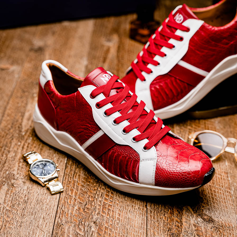 The Marco Di Milano Lyon Red / White are luxury low-top sneakers featuring a hand-painted finish, textured leather, white soles, red laces, and black tread, showcased on a plain white background.