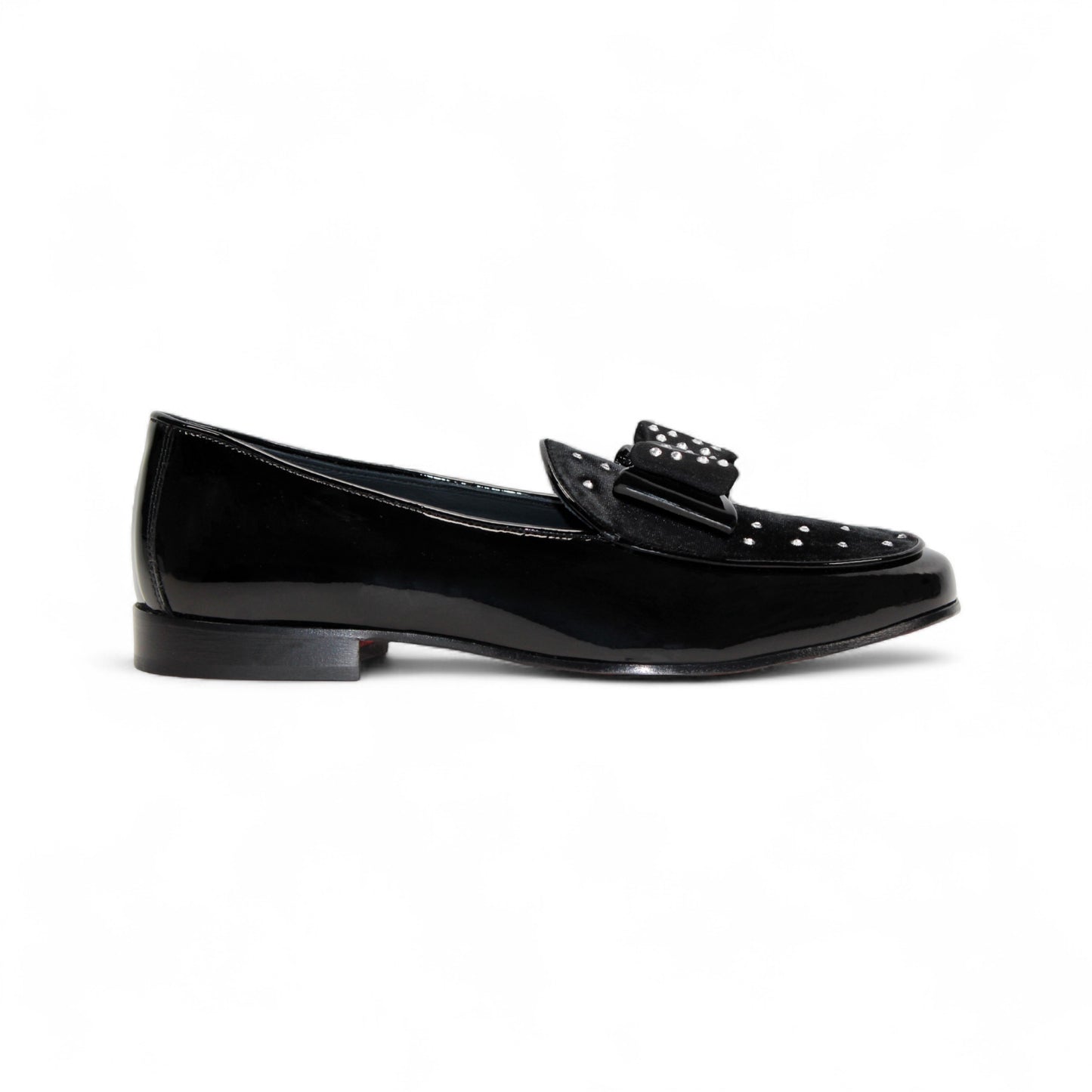 The Duca Maratea Black by Duca Di Matiste is a black patent leather loafer with a low heel, suede strap, and metal studs, highlighting fine Italian craftsmanship against a white background.
