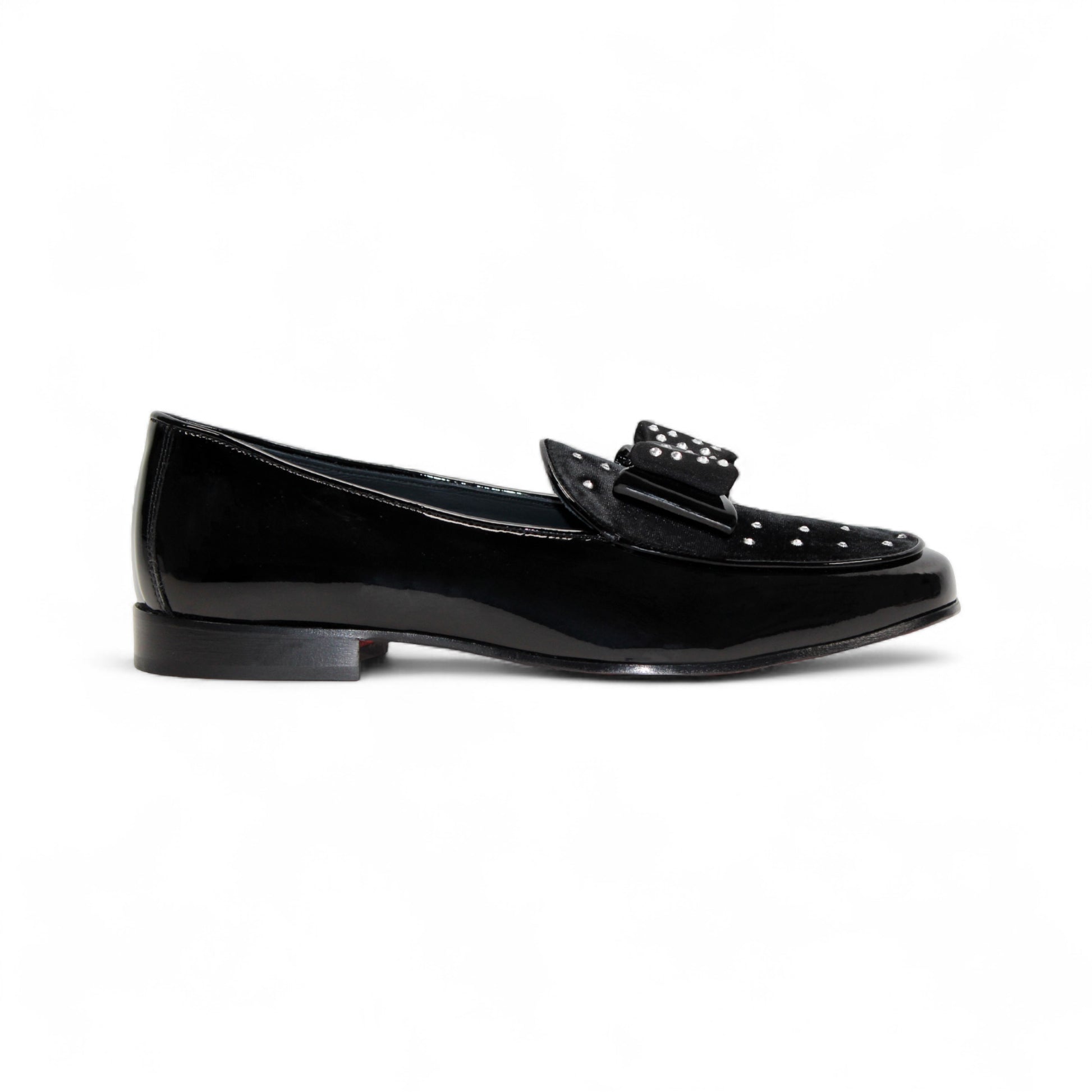 The Duca Maratea Black by Duca Di Matiste is a black patent leather loafer with a low heel, suede strap, and metal studs, highlighting fine Italian craftsmanship against a white background.
