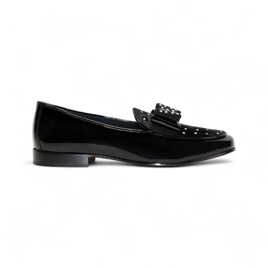 The Duca Maratea Black by Duca Di Matiste is a black patent leather loafer with a low heel, suede strap, and metal studs, highlighting fine Italian craftsmanship against a white background.