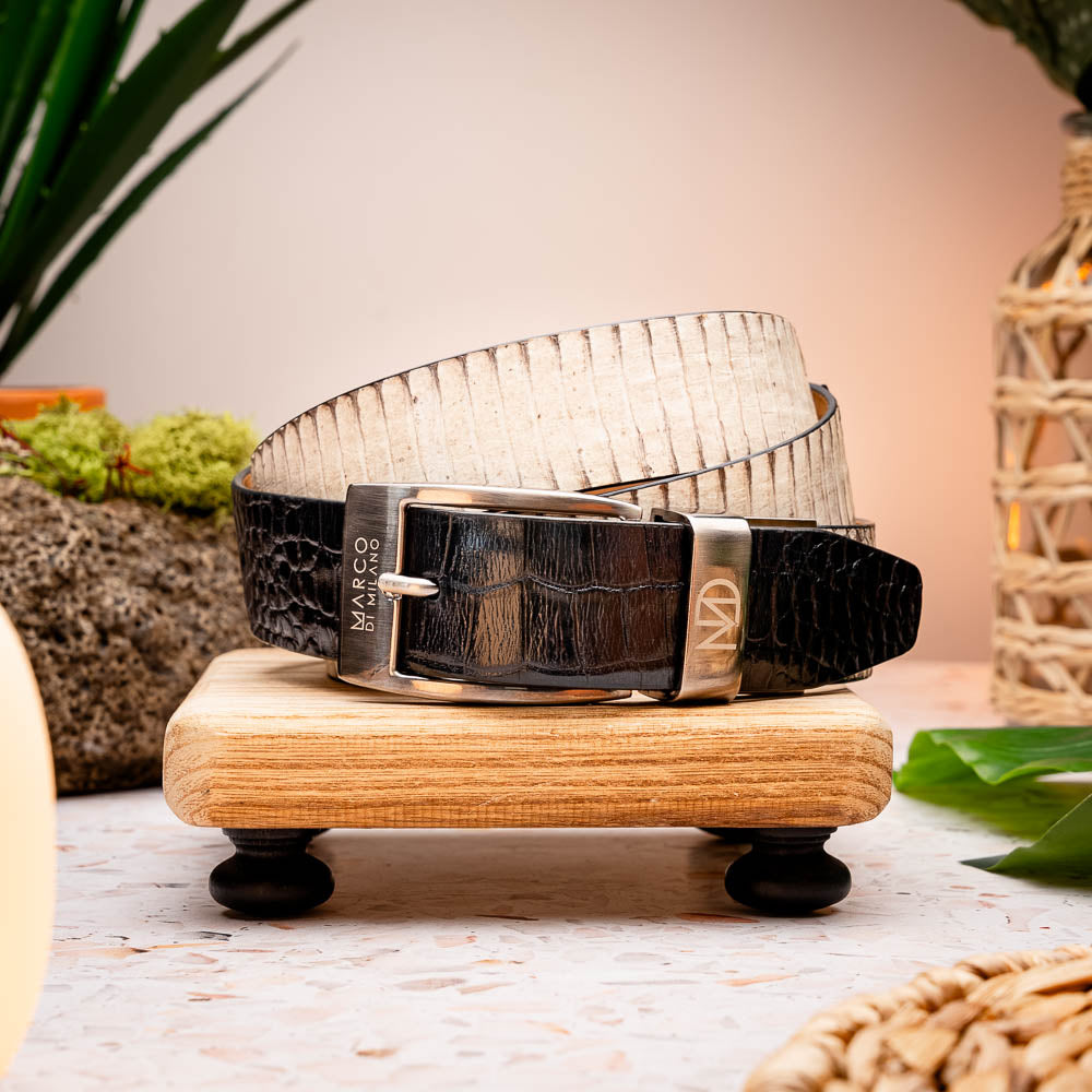 The Moncalieri Belt Bone / Black by Marco Di Milano features a textured white outer and black crocodile pattern by a silver buckle, mirroring the elegance of alligator and cobra skin to complement luxury footwear.