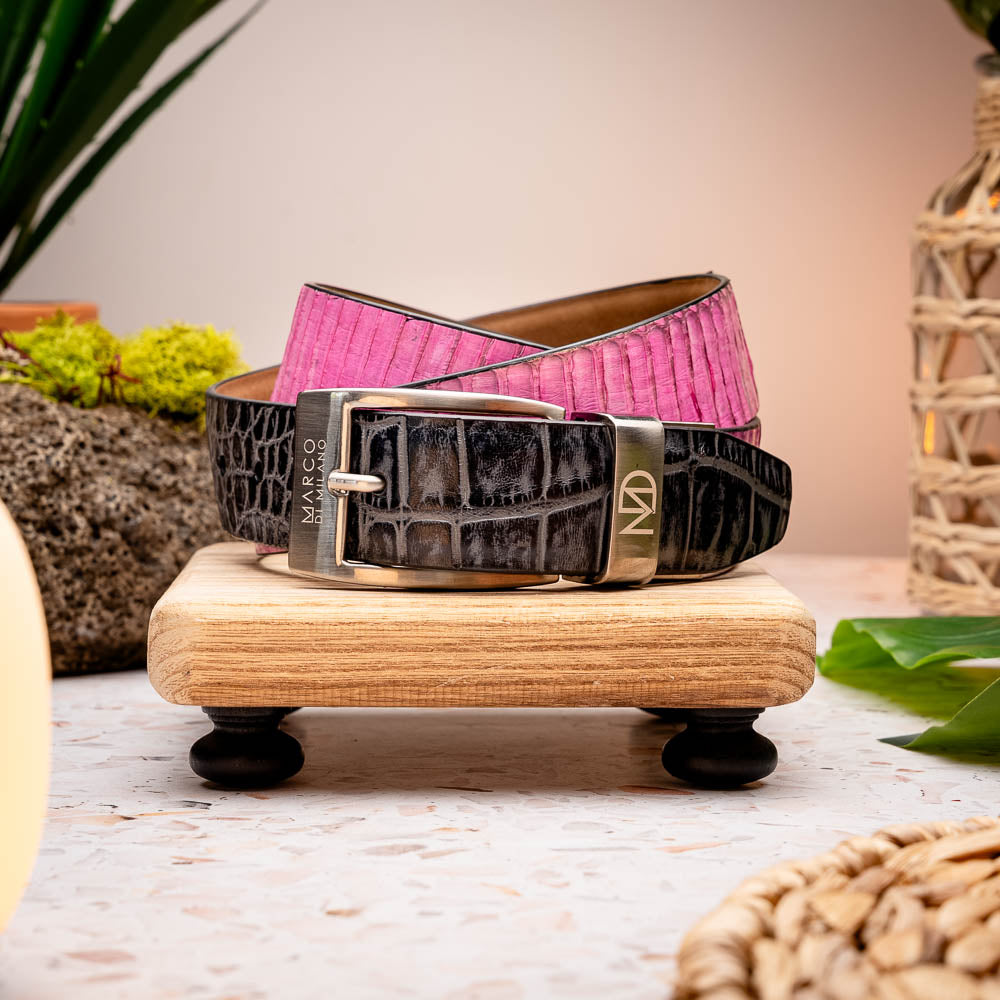 The Moncalieri Belt Pink / Gray by Marco Di Milano features a textured gray exterior, vibrant pink interior, and a silver logo-engraved buckle, showcasing the brand’s signature luxury style in genuine alligator and cobra skin.