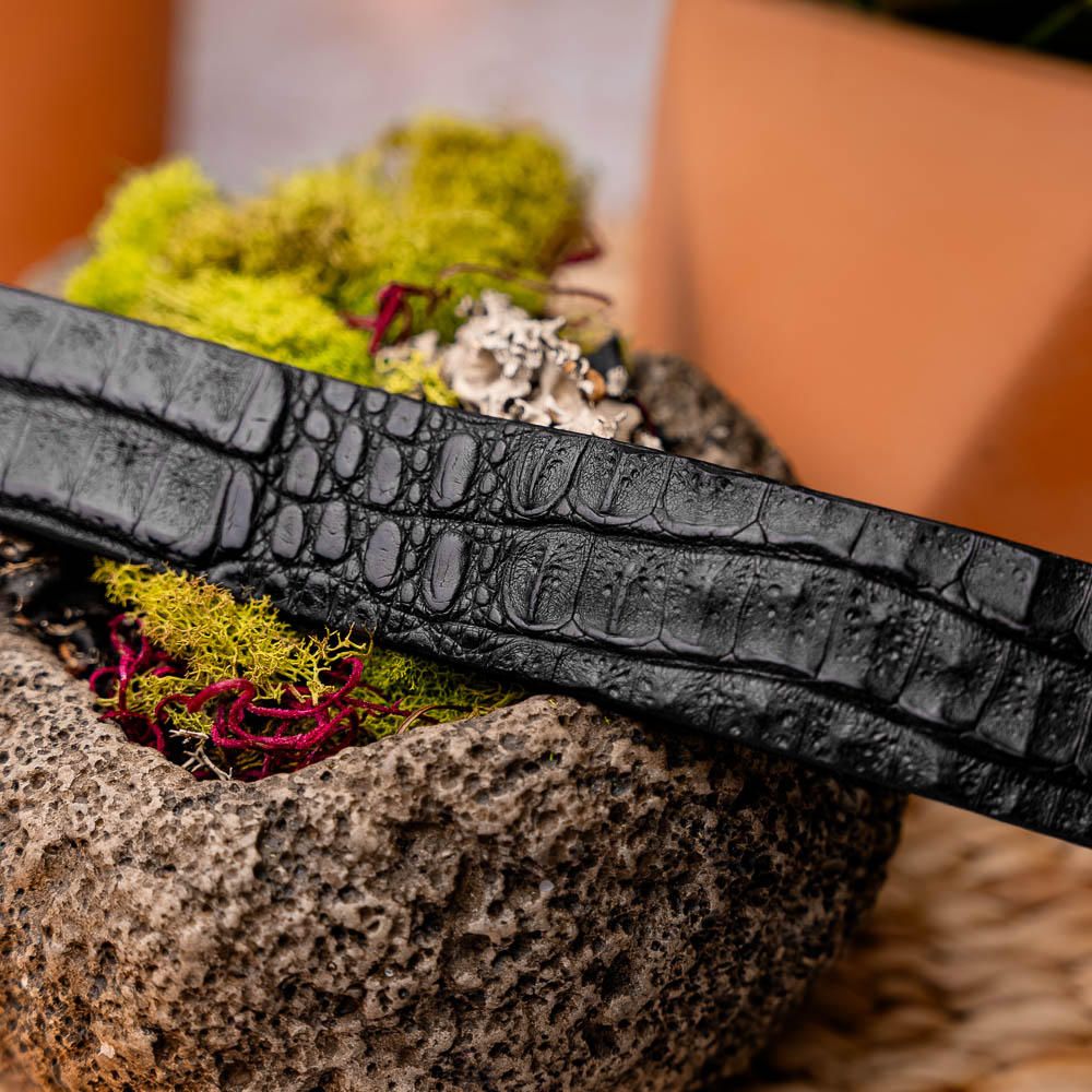 The Riccardo Belt Black by Marco Di Milano features a fuscus-belly crocodile pattern, silver logo buckle, and genuine exotic leather—perfect for refined style.