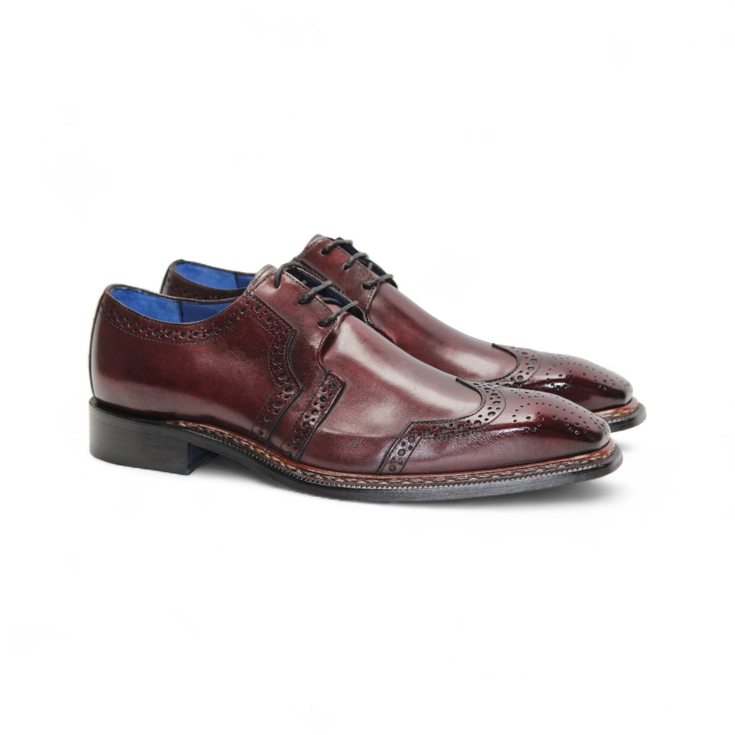 The Emilio Franco Marco Burgundy by Emilio Franco is a genuine leather oxford dress shoe with brogue detailing, closed lacing, and a low black heel, shown in profile on white—an elegant choice among timeless men's footwear.