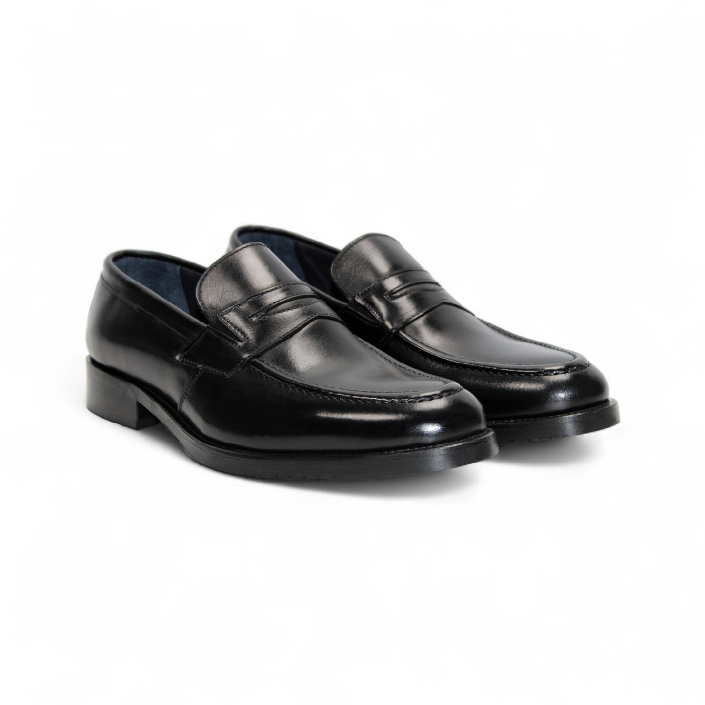 The Firmani Mark Black loafer by Firmani, crafted from Italian leather, is shown in a left side profile on a plain white background—an elegant option in men’s dress shoes.
