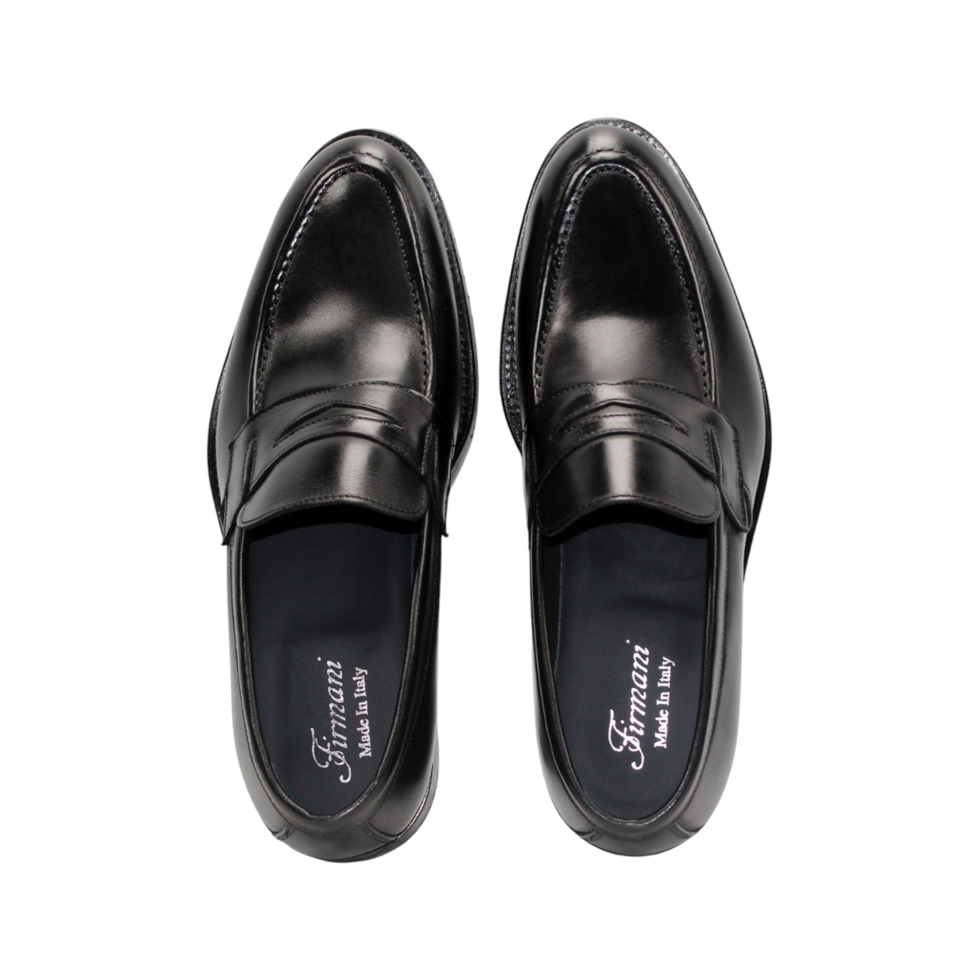 The Firmani Mark Black loafer by Firmani, crafted from Italian leather, is shown in a left side profile on a plain white background—an elegant option in men’s dress shoes.
