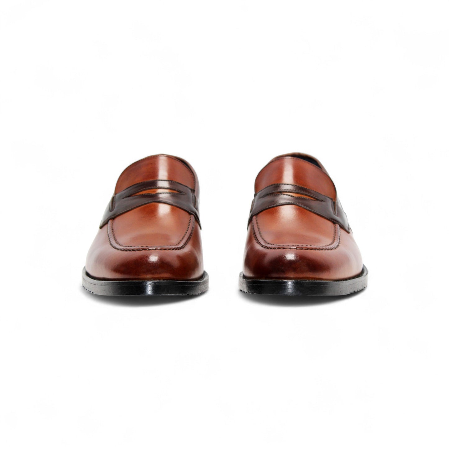 The Firmani Mark Cognac/Brown by Firmani is a men's loafer in genuine brown leather with darker trim, low heel, and moccasin stitching—an elegant dress shoe shown in side profile against a white background.