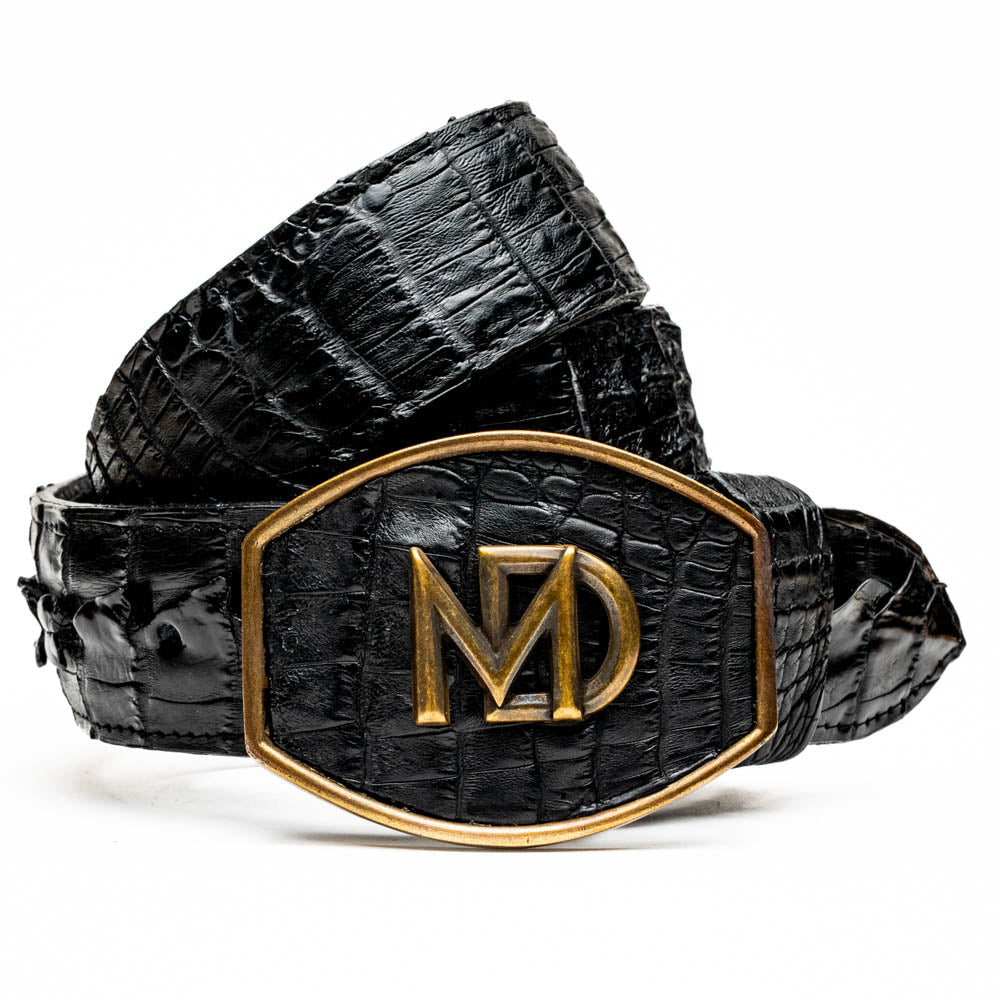 The Marlboro Belt Black by Marco Di Milano features textured hornback caiman leather and a gold buckle with stylized "MD" initials, displayed against a white background.