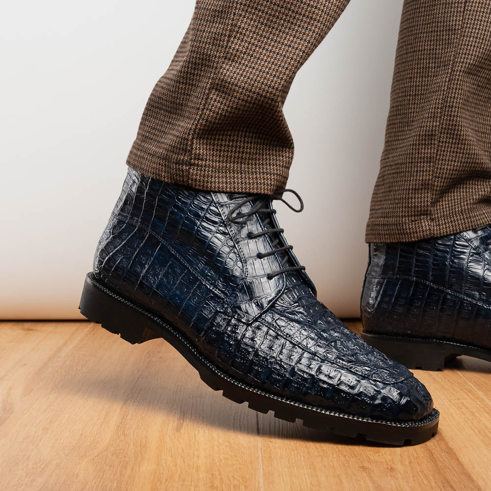 The Martinelli Navy by Marco Di Milano are genuine caiman crocodile boots in dark blue with a lace-up design and rugged black soles—perfect for men who love exotic footwear.