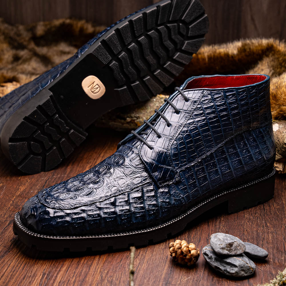 The Martinelli Navy by Marco Di Milano are genuine caiman crocodile boots in dark blue with a lace-up design and rugged black soles—perfect for men who love exotic footwear.