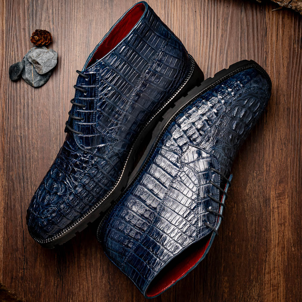 The Martinelli Navy by Marco Di Milano are genuine caiman crocodile boots in dark blue with a lace-up design and rugged black soles—perfect for men who love exotic footwear.