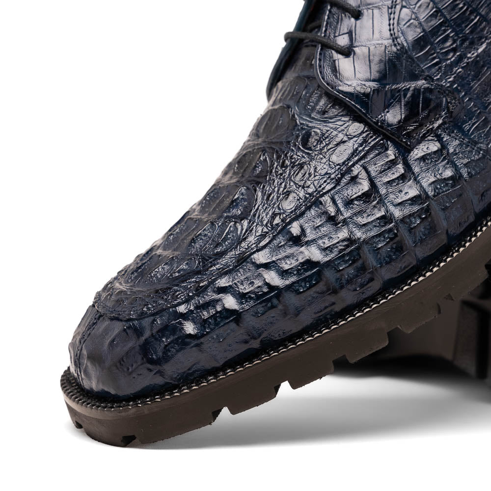 The Martinelli Navy by Marco Di Milano are genuine caiman crocodile boots in dark blue with a lace-up design and rugged black soles—perfect for men who love exotic footwear.