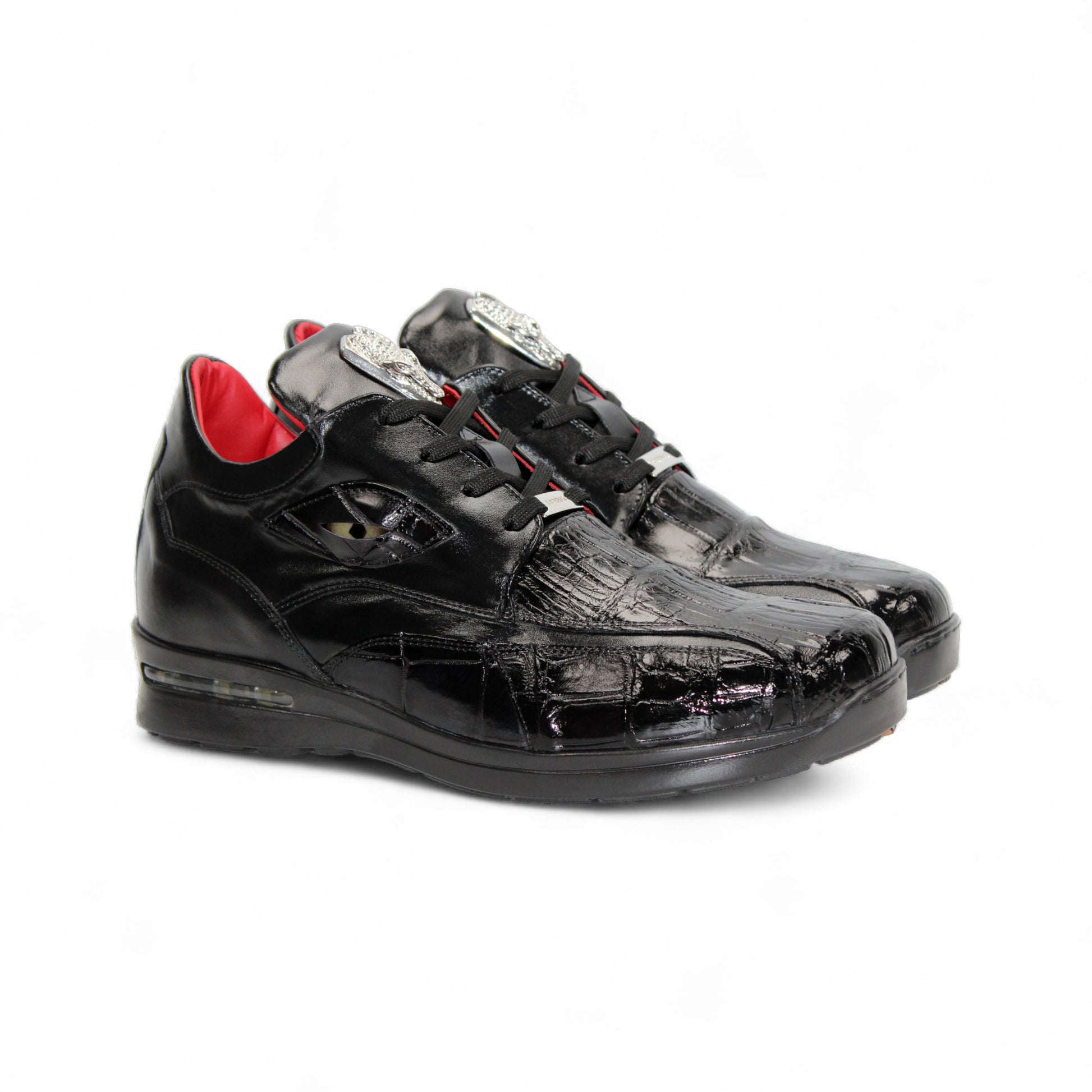 The Fennix Mason Black by Fennix of Italy is a black leather sneaker with textured detail, black laces, low heel, and red inner lining—an elegant modern style shown in profile on a white background.