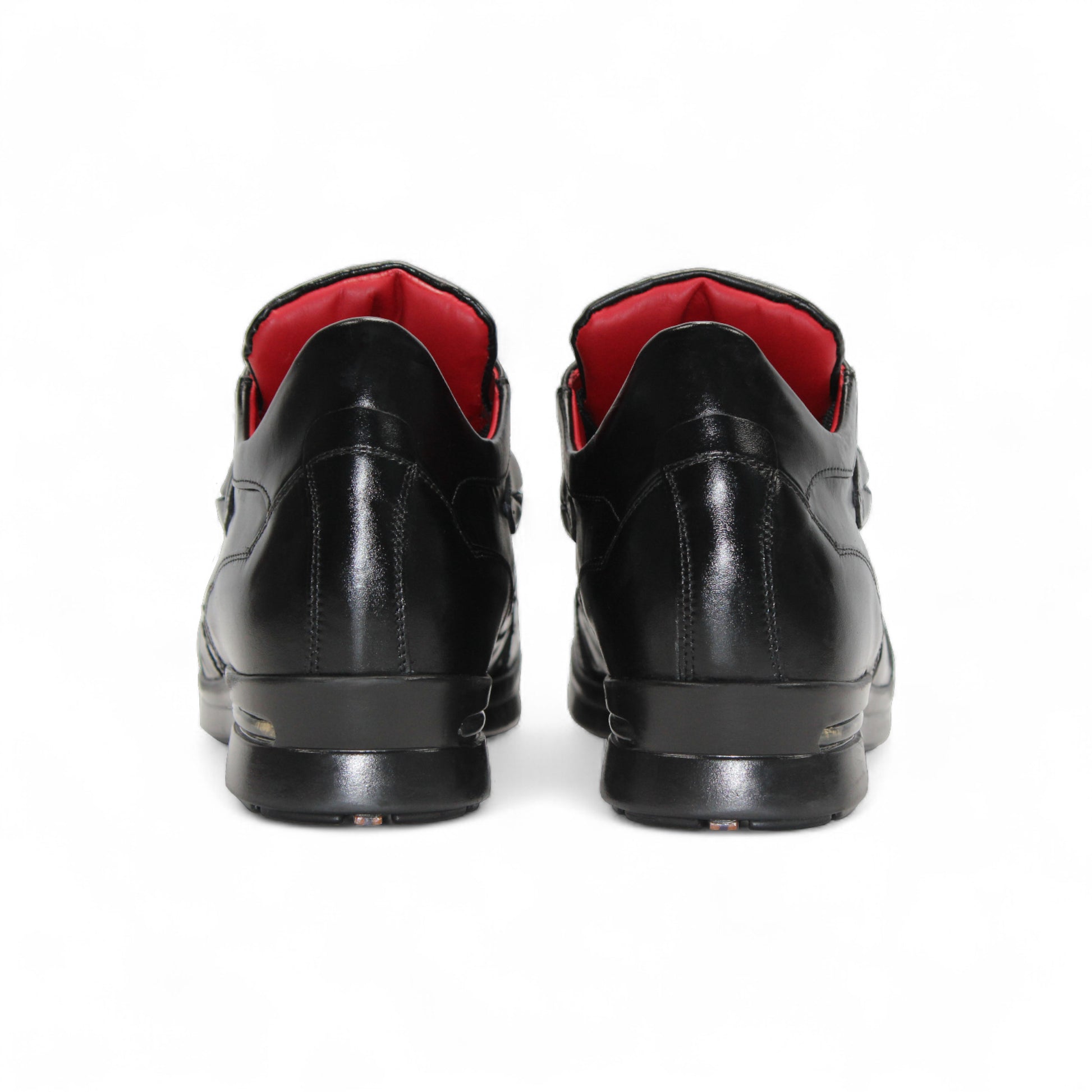 The Fennix Mason Black by Fennix of Italy is a black leather sneaker with textured detail, black laces, low heel, and red inner lining—an elegant modern style shown in profile on a white background.