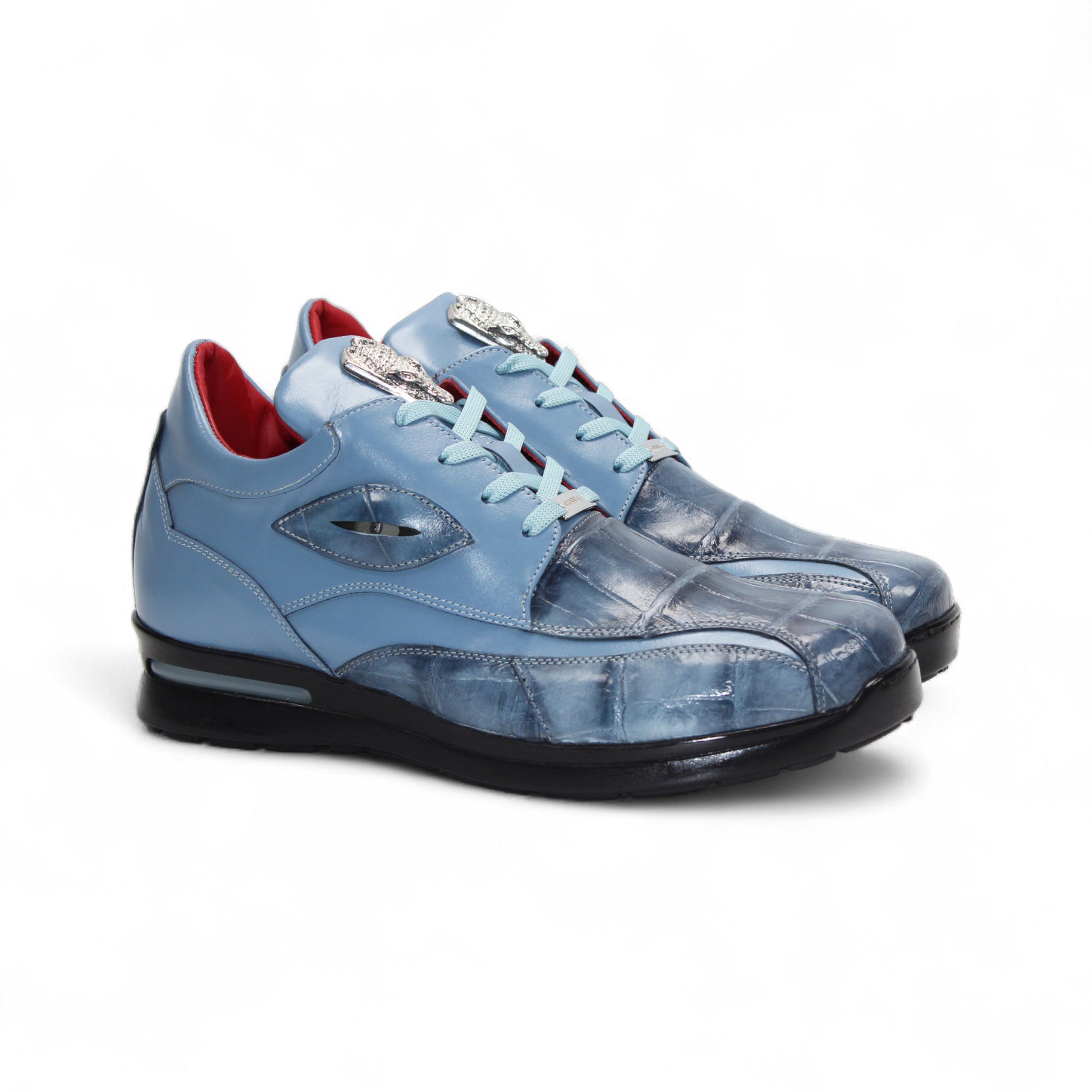 The Fennix of Italy Fennix Mason Light Blue sneaker features modern blue leather design, light blue laces, a black sole, and red interior accents, shown individually on a white background.