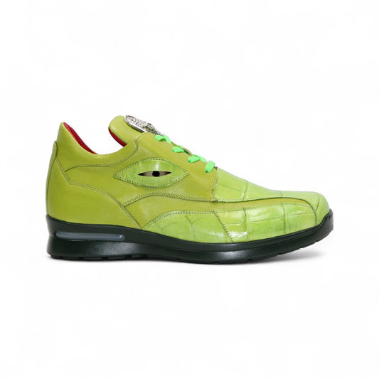The Fennix Mason Green by Fennix of Italy is a bright green sneaker with a reptile-skin pattern, light green laces, black sole, and a distinctive oval-shaped eyelet detail on the side—an ode to classic Italian alligator shoes.