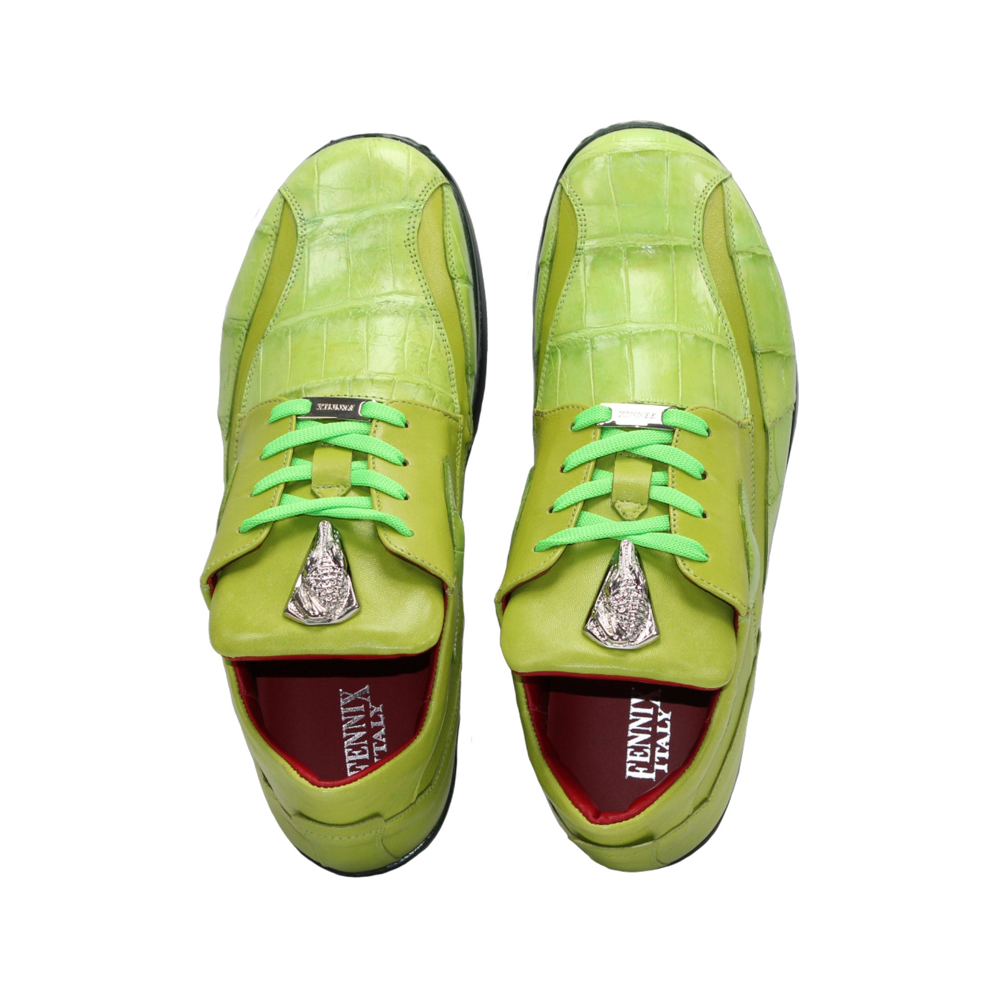 The Fennix Mason Green by Fennix of Italy is a bright green sneaker with a reptile-skin pattern, light green laces, black sole, and a distinctive oval-shaped eyelet detail on the side—an ode to classic Italian alligator shoes.