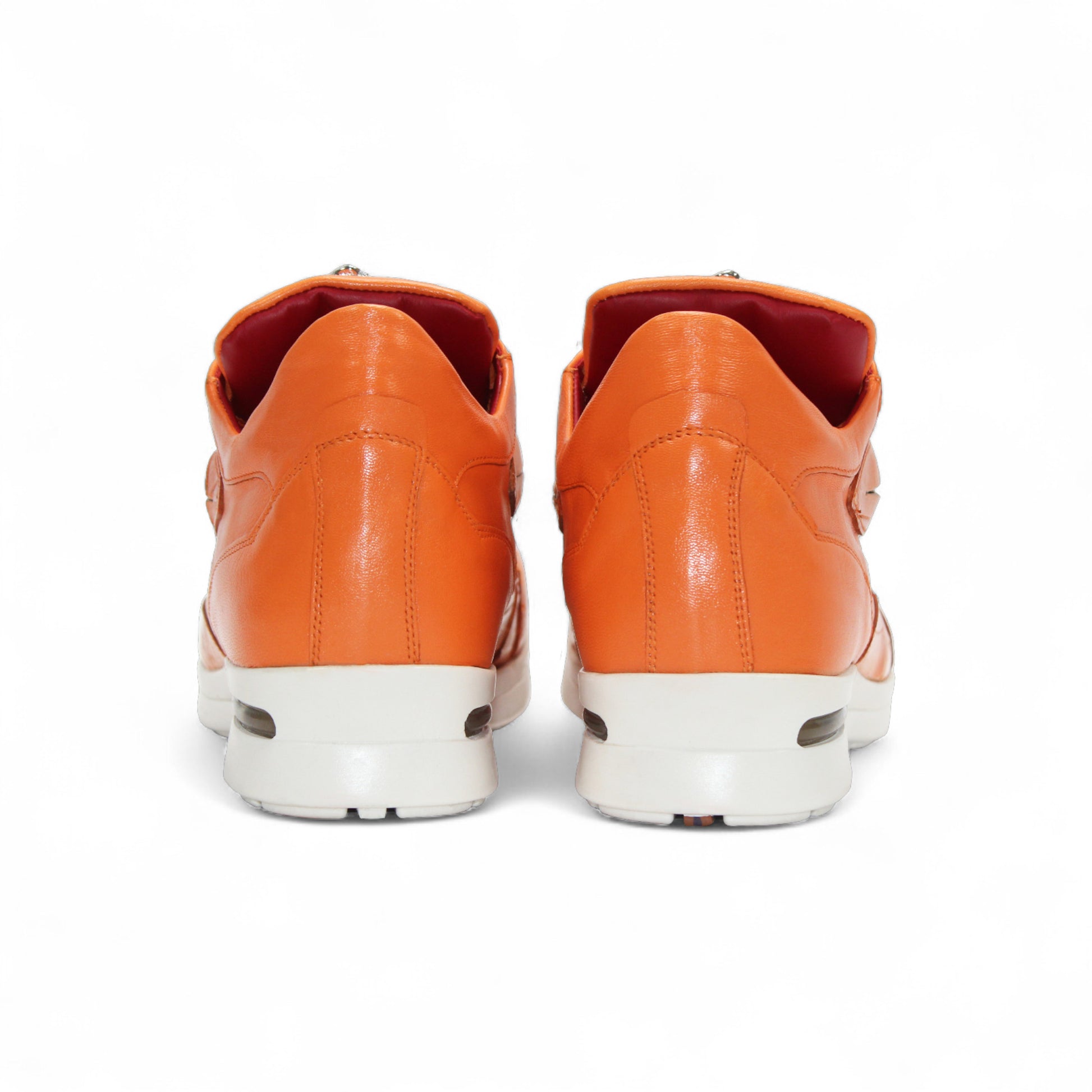 The Fennix Mason Orange by Fennix of Italy is an Italian leather sneaker with a white sole, side cut-out, and lace-up closure—a modern footwear choice to elevate your everyday style.