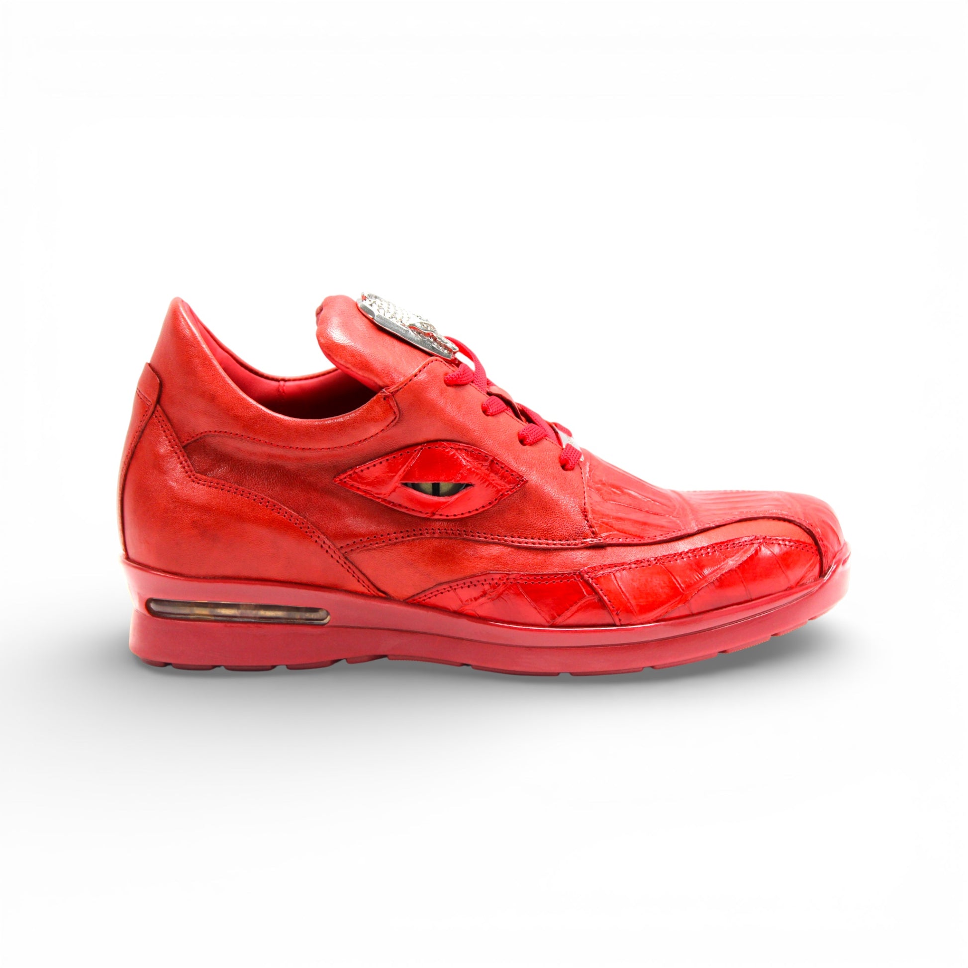 The Fennix Mason Red by Fennix of Italy is a modern red leather athletic shoe with laces and a tongue emblem, displayed in side profile on a white background.