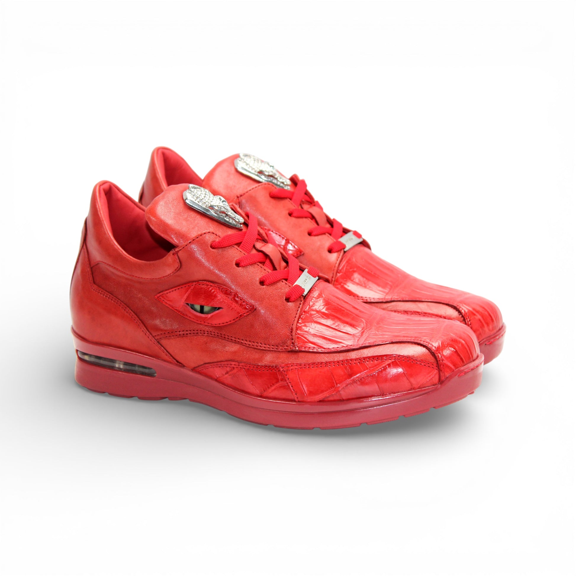 The Fennix Mason Red by Fennix of Italy is a modern red leather athletic shoe with laces and a tongue emblem, displayed in side profile on a white background.