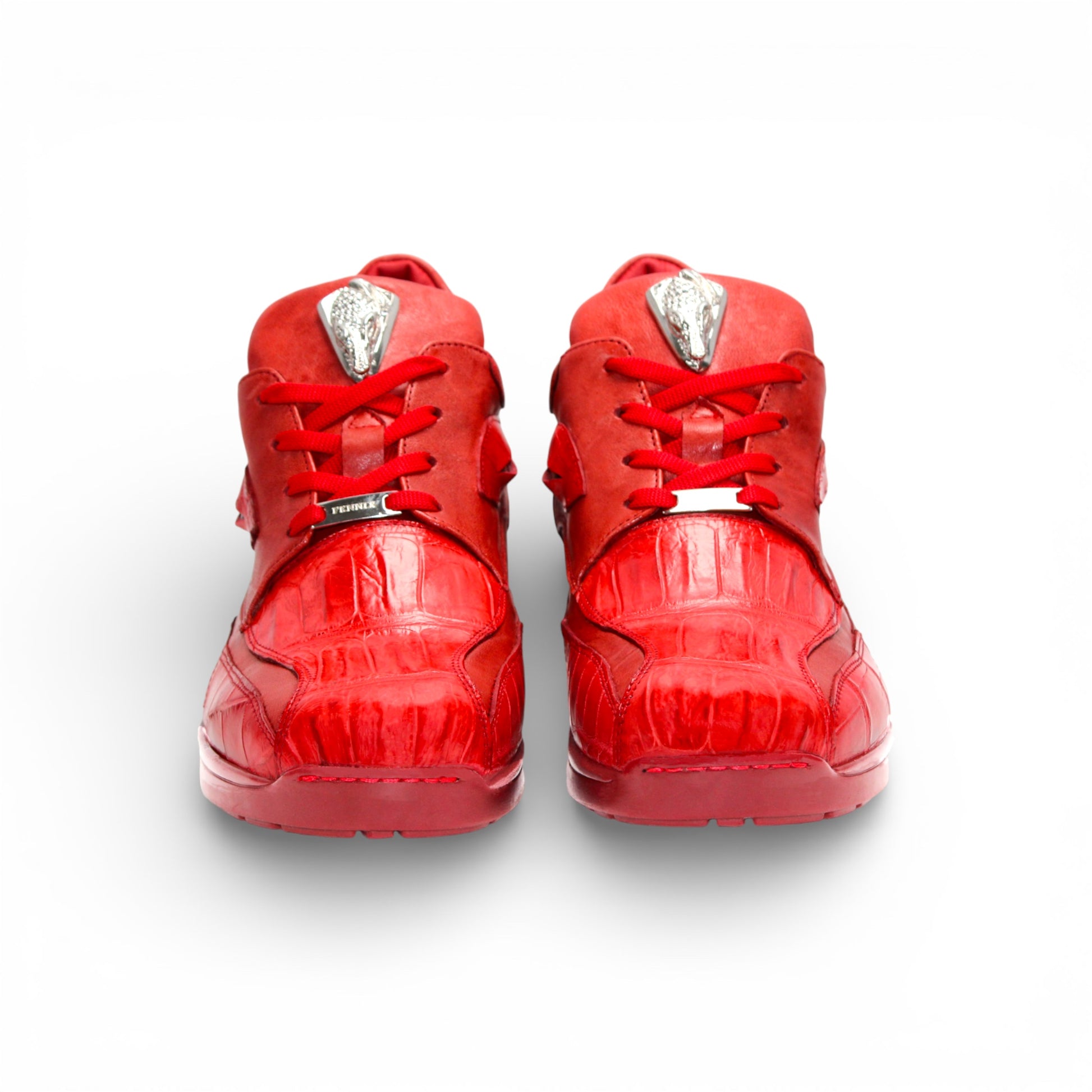 The Fennix Mason Red by Fennix of Italy is a modern red leather athletic shoe with laces and a tongue emblem, displayed in side profile on a white background.