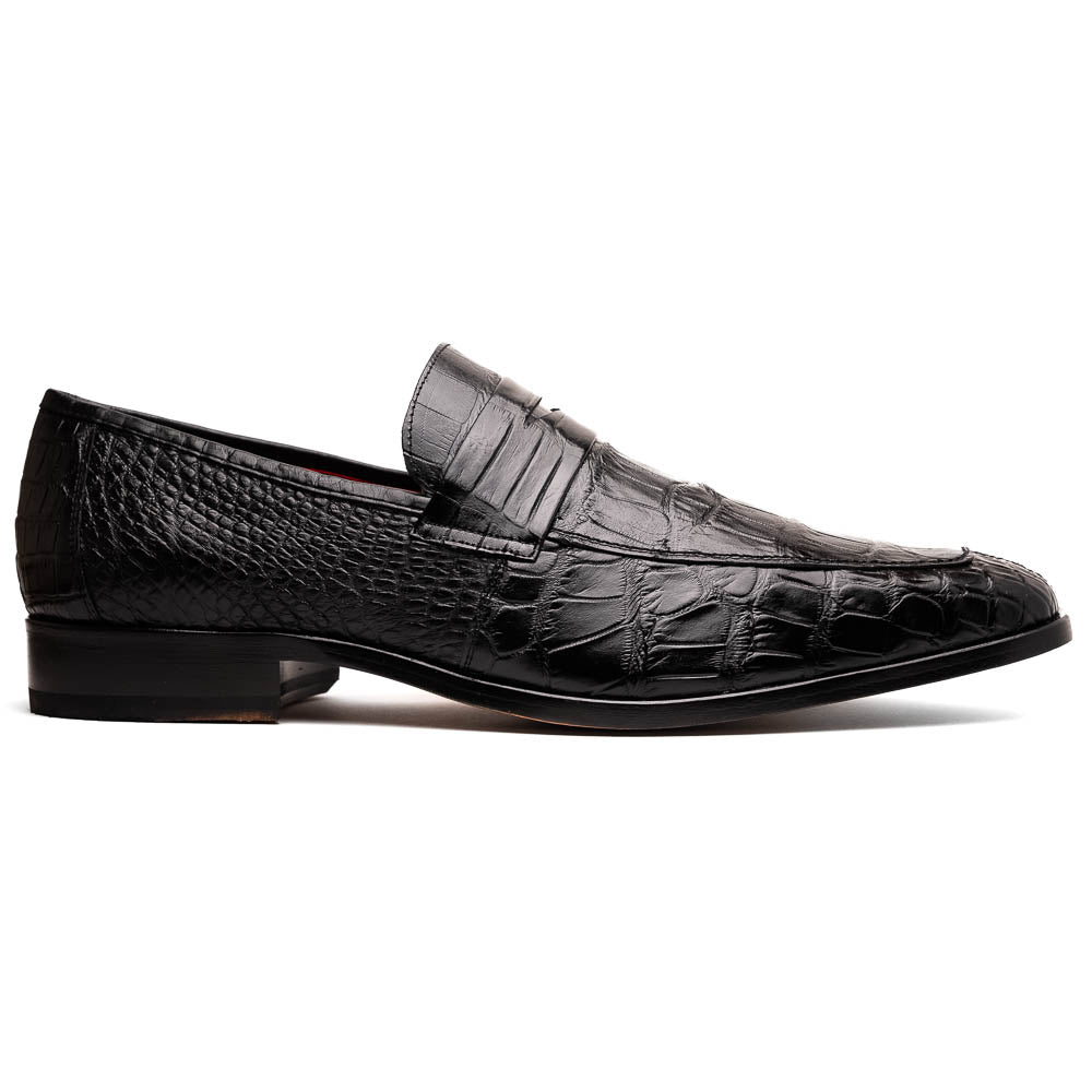 The Matteo Black by Marco Di Milano is a pair of black genuine alligator slip-on shoes with a polished brown leather sole, embossed branding, and hand-painted finishes, shown against a white background.