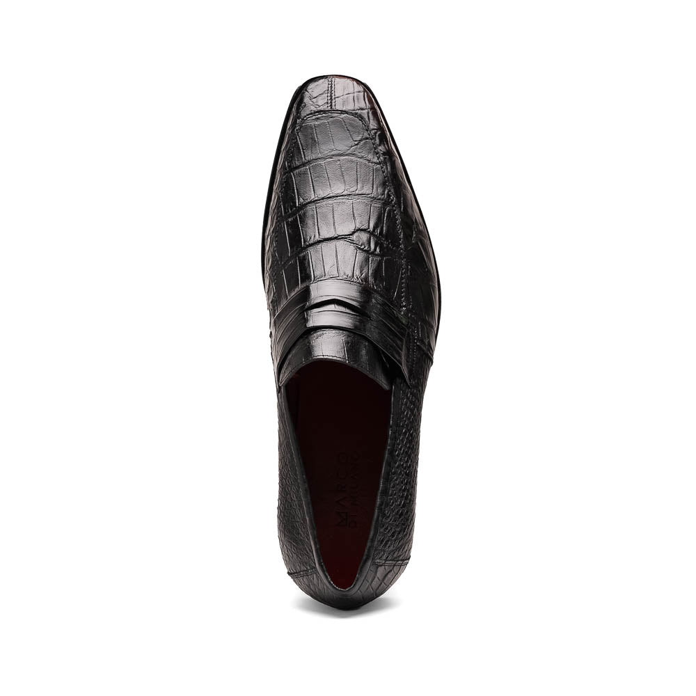 The Matteo Black by Marco Di Milano is a pair of black genuine alligator slip-on shoes with a polished brown leather sole, embossed branding, and hand-painted finishes, shown against a white background.