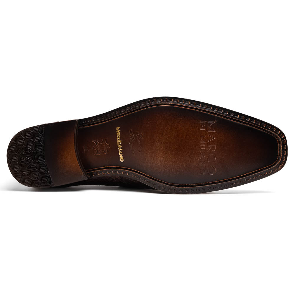 The Matteo Brown by Marco Di Milano is a pair of brown luxury loafers with a crocodile pattern; one shoe lies flat while the other is propped to showcase the sole and elegant hand-painted finishes.