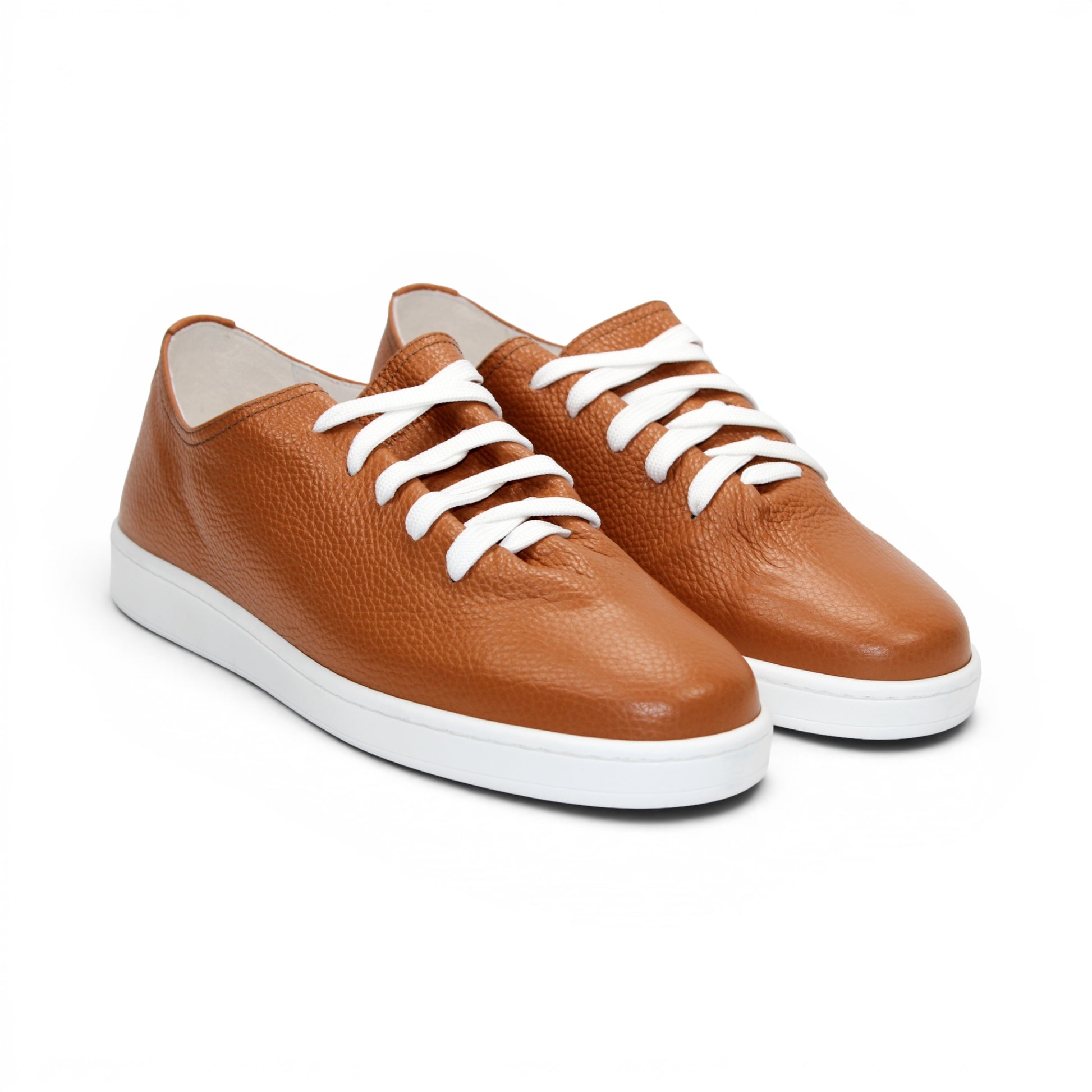 The Duca Max Latte sneaker by Duca Di Matiste features premium brown Italian Dollaro leather, white laces, and a white rubber sole, displayed in side profile against a white background.