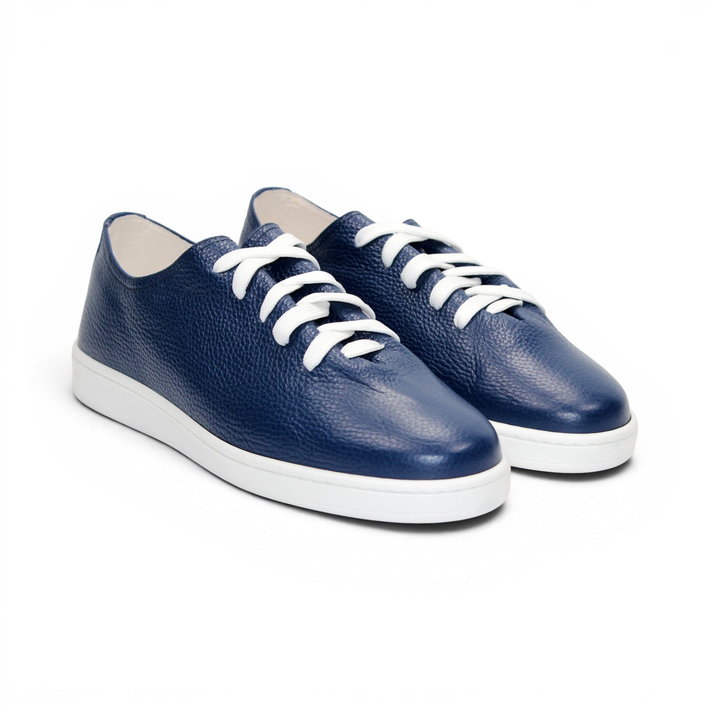 The Duca Max Jeans sneaker by Duca Di Matiste, made from premium navy blue Italian Dollaro leather, features white laces and a white rubber sole, shown in side profile against a plain white background for a modern casual look.
