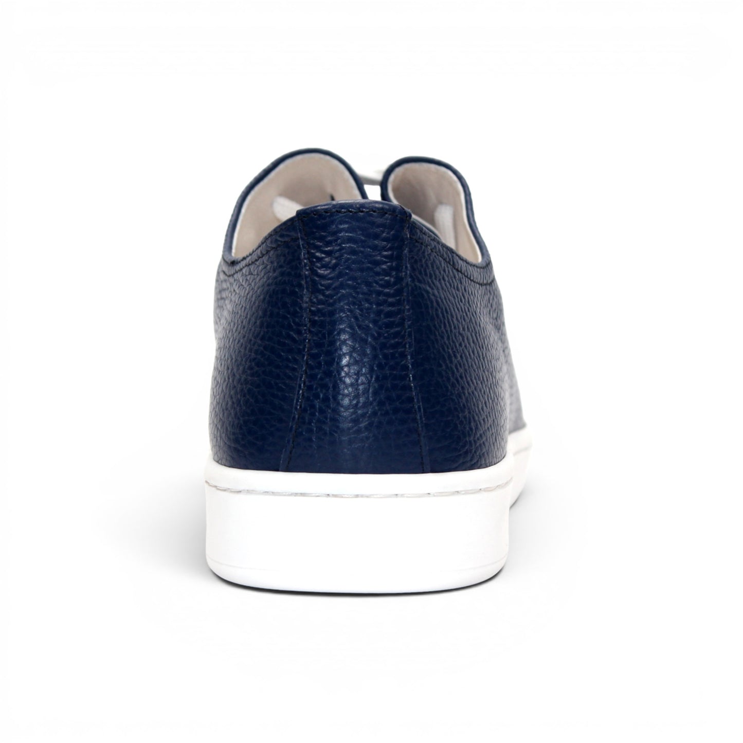 The Duca Max Jeans sneaker by Duca Di Matiste, made from premium navy blue Italian Dollaro leather, features white laces and a white rubber sole, shown in side profile against a plain white background for a modern casual look.