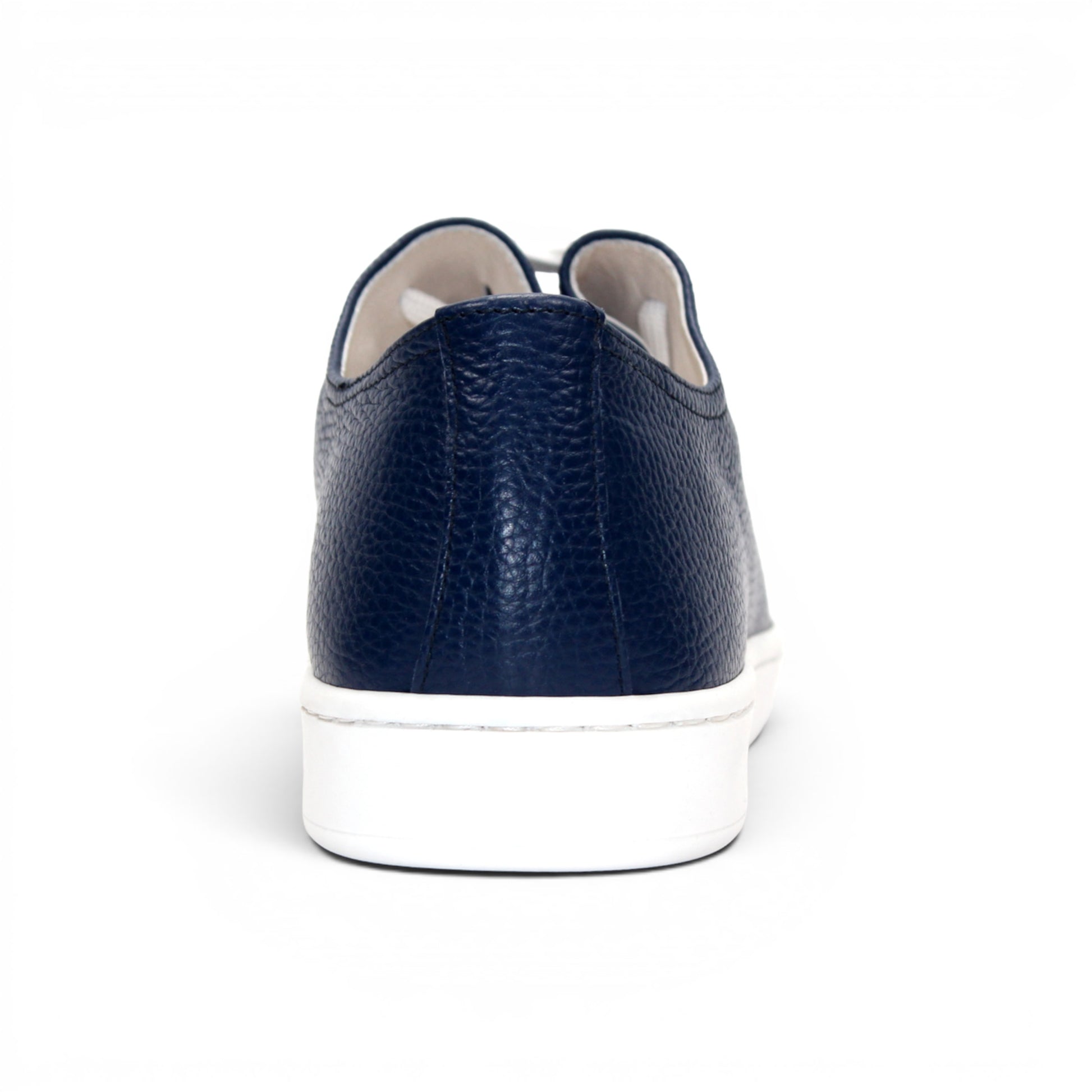 The Duca Max Jeans sneaker by Duca Di Matiste, made from premium navy blue Italian Dollaro leather, features white laces and a white rubber sole, shown in side profile against a plain white background for a modern casual look.
