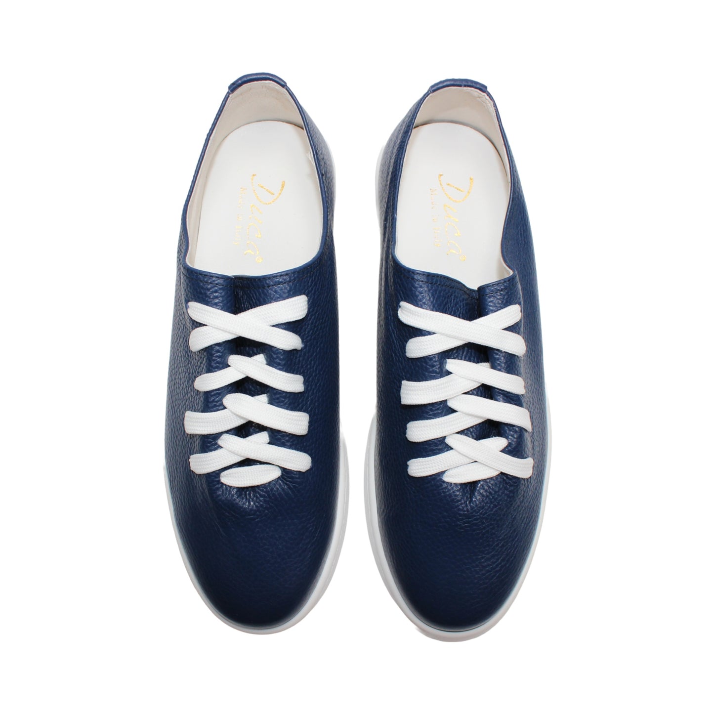 The Duca Max Jeans sneaker by Duca Di Matiste, made from premium navy blue Italian Dollaro leather, features white laces and a white rubber sole, shown in side profile against a plain white background for a modern casual look.