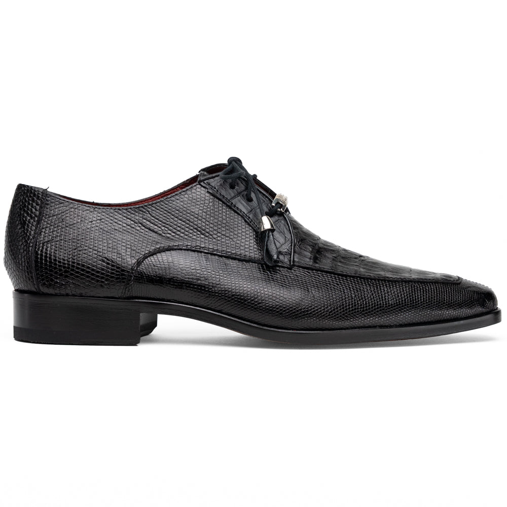 A pair of Merida Black dress derby shoes by Marco Di Milano, crafted from textured black leather caiman—one upright and one on its side revealing the brown sole stamped with the brand’s logo—an unmistakable statement in luxury footwear.