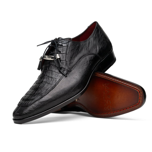 A pair of Merida Black dress derby shoes by Marco Di Milano, crafted from textured black leather caiman—one upright and one on its side revealing the brown sole stamped with the brand’s logo—an unmistakable statement in luxury footwear.
