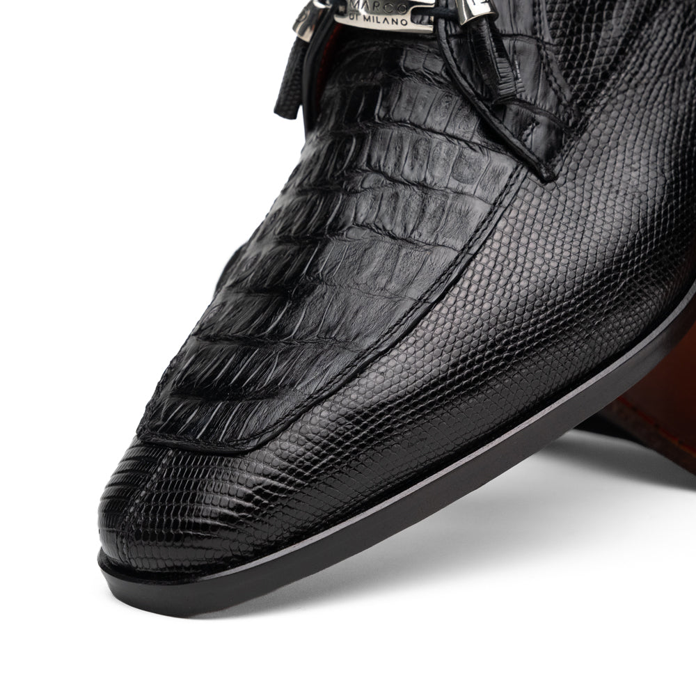 A pair of Merida Black dress derby shoes by Marco Di Milano, crafted from textured black leather caiman—one upright and one on its side revealing the brown sole stamped with the brand’s logo—an unmistakable statement in luxury footwear.