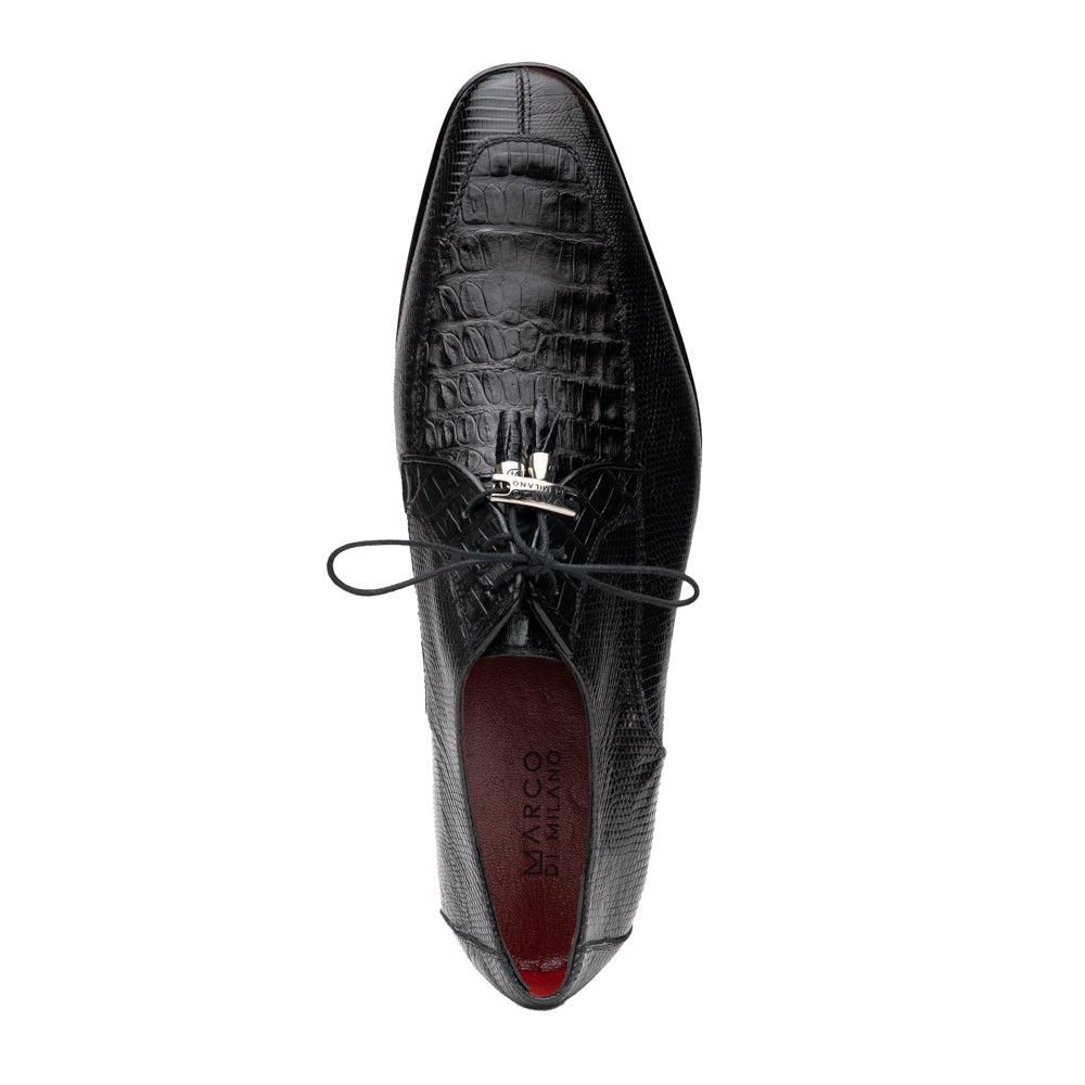 A pair of Merida Black dress derby shoes by Marco Di Milano, crafted from textured black leather caiman—one upright and one on its side revealing the brown sole stamped with the brand’s logo—an unmistakable statement in luxury footwear.