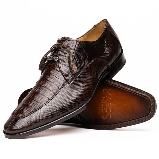 The Merida Brown by Marco Di Milano: a pair of dark brown, textured caiman dress derby shoes with laces—one upright and the other on its side revealing the sole—ideal for those seeking genuine exotic luxury footwear.