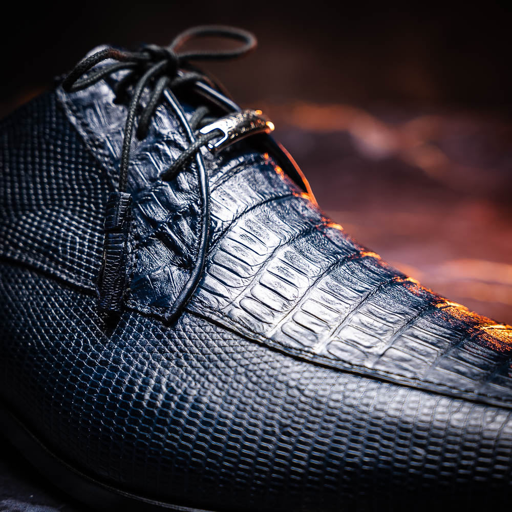 The Merida Navy by Marco Di Milano: blue textured leather caiman dress derby shoes, shown upright and on their side to highlight the sole and striking red inner lining—an elegant expression of luxury footwear.