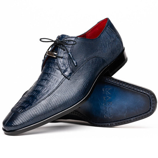 The Merida Navy by Marco Di Milano: blue textured leather caiman dress derby shoes, shown upright and on their side to highlight the sole and striking red inner lining—an elegant expression of luxury footwear.