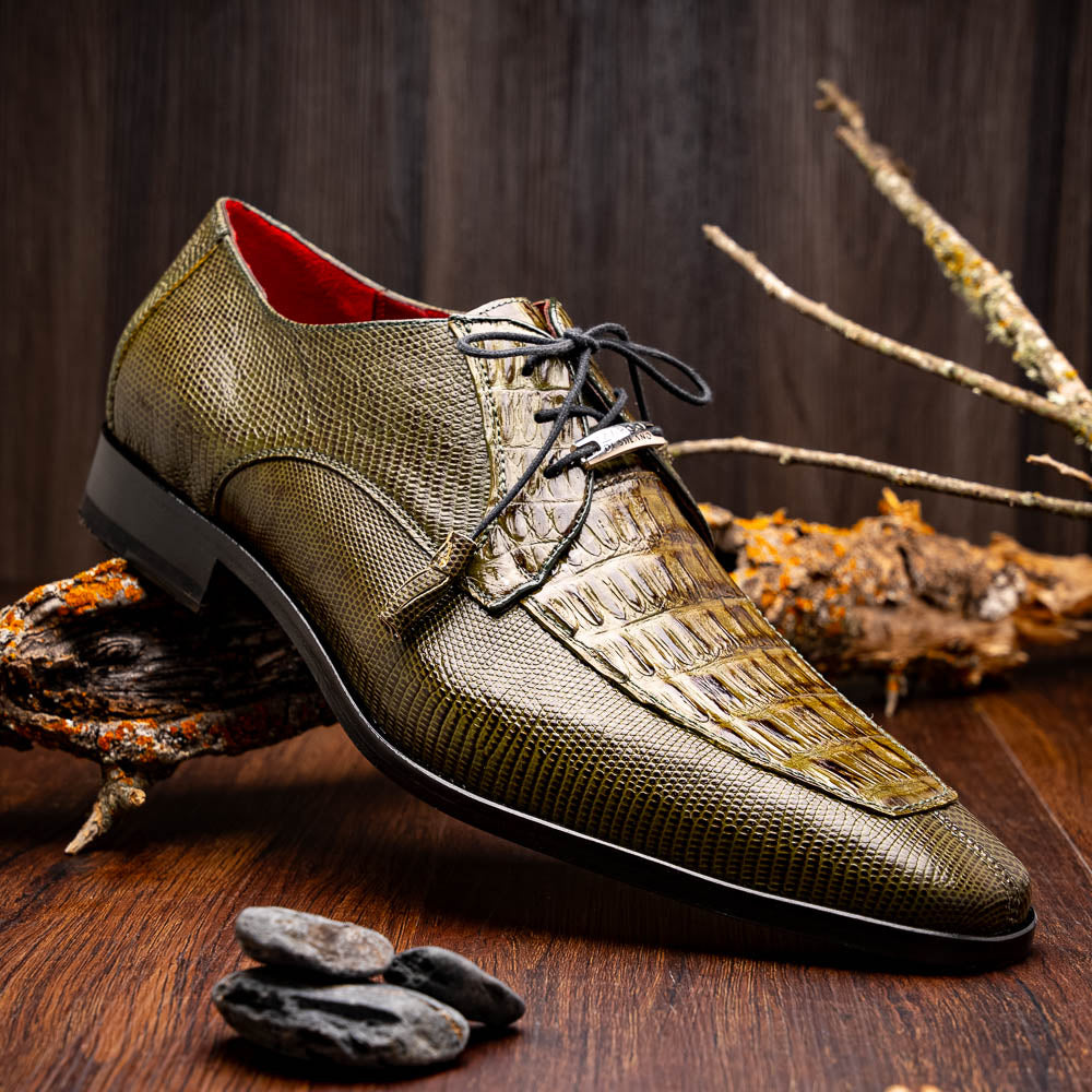 The Merida Olive Green by Marco Di Milano is a pair of olive green textured leather caiman Derby shoes with black laces, red interior lining, dark soles, embossed branding, and hand-painted finishes—a true luxury statement.