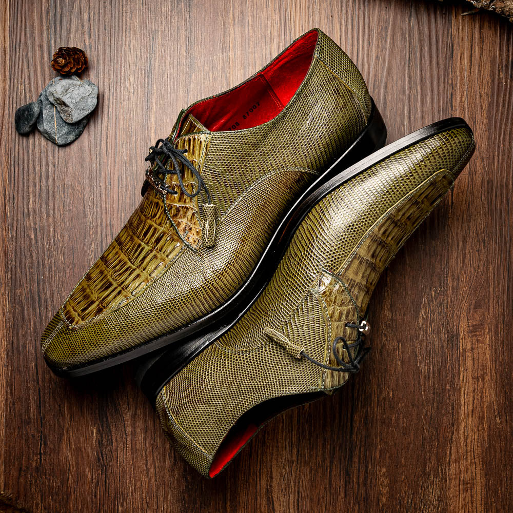 The Merida Olive Green by Marco Di Milano is a pair of olive green textured leather caiman Derby shoes with black laces, red interior lining, dark soles, embossed branding, and hand-painted finishes—a true luxury statement.