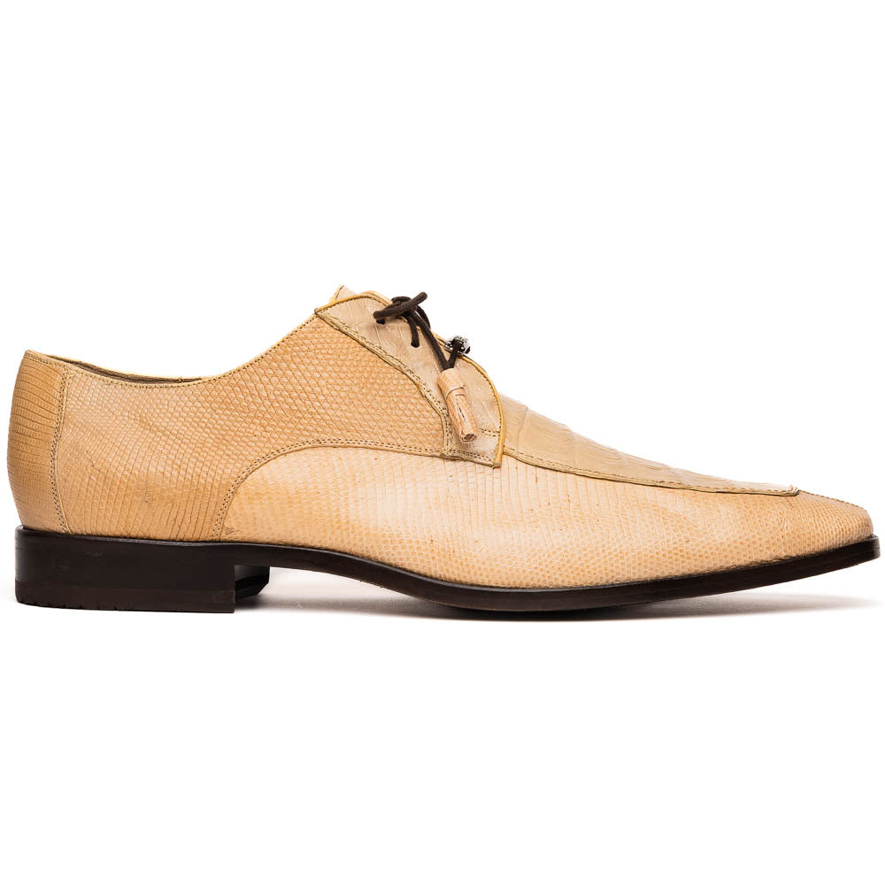 A pair of beige Merida Orix dress derby shoes by Marco Di Milano with black laces, one upright and one leaning to reveal the branded sole—a striking statement in luxury footwear.