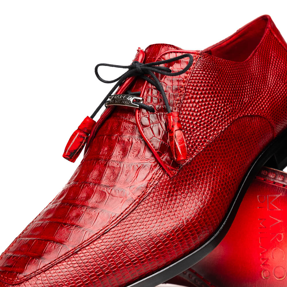 The Merida Red by Marco Di Milano are red textured leather luxury dress shoes with black laces and red tassels, shown both upright and sideways to highlight their hand-painted sole finishes.