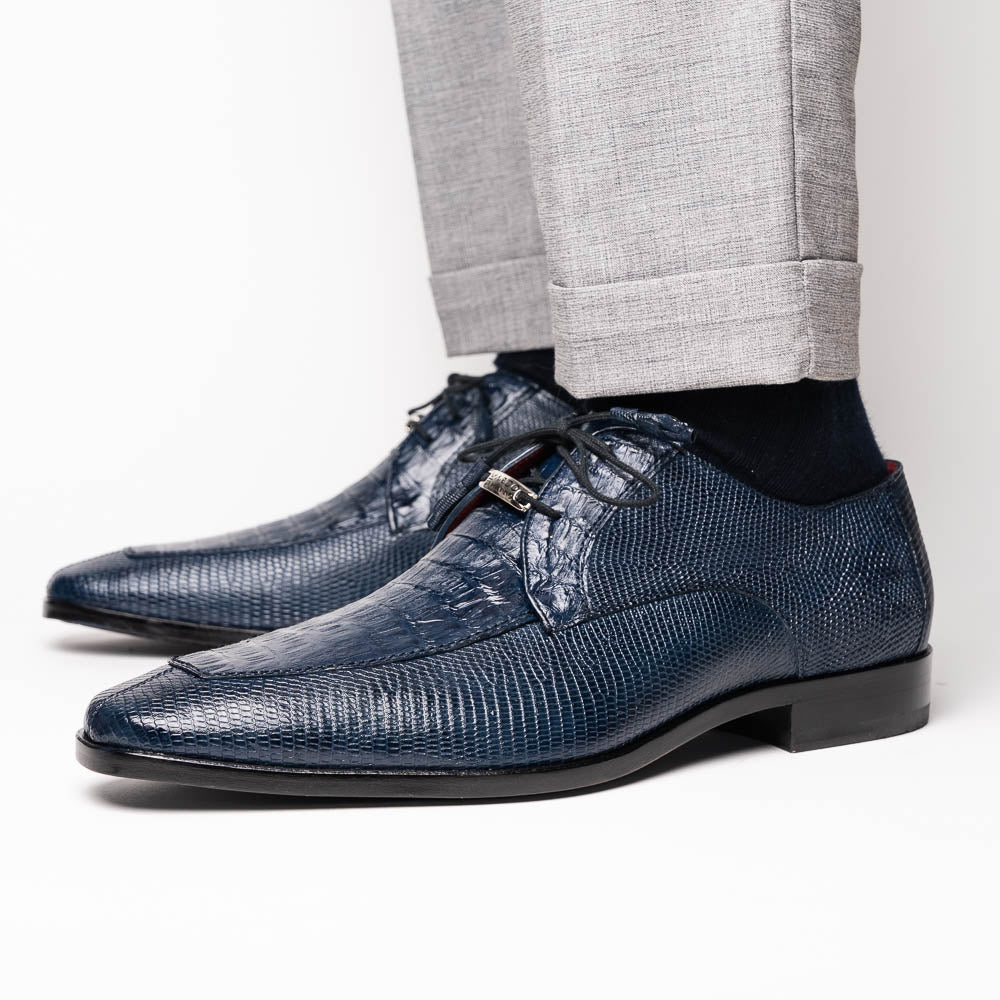 The Merida Navy by Marco Di Milano: blue textured leather caiman dress derby shoes, shown upright and on their side to highlight the sole and striking red inner lining—an elegant expression of luxury footwear.