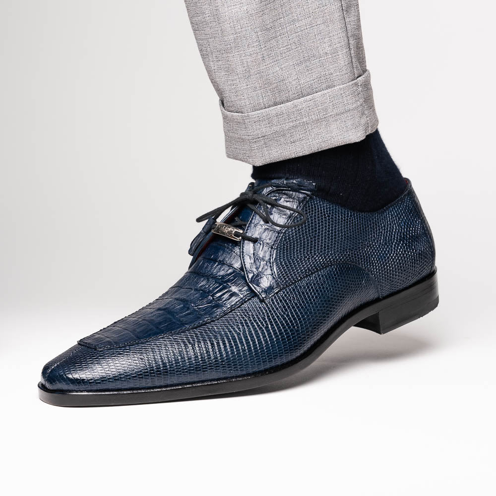 The Merida Navy by Marco Di Milano: blue textured leather caiman dress derby shoes, shown upright and on their side to highlight the sole and striking red inner lining—an elegant expression of luxury footwear.