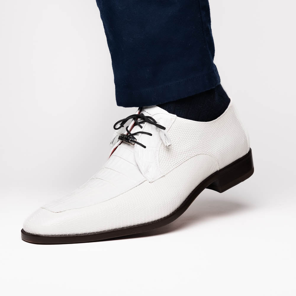 The Merida White by Marco Di Milano: luxury white textured leather caiman derby shoes with black soles, black laces, and brown leather outsoles, displayed with one shoe on its side.